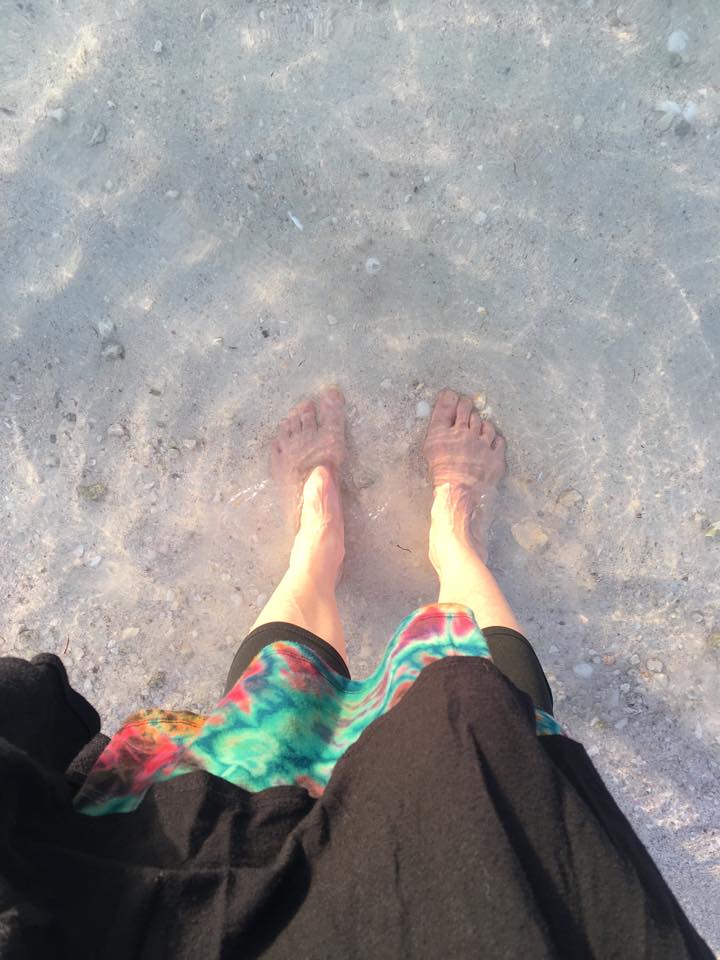 Abu Dhabi public beach. Feet in the gulf.